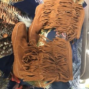 Tall fringed moccasins